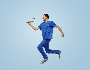 Image showing doctor or male nurse with stethoscope jumping