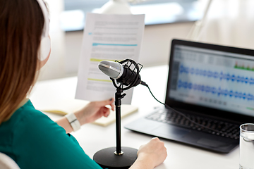 Image showing woman with microphone recording podcast at studio