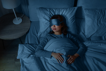 Image showing asian woman sleeping in bed at home at night