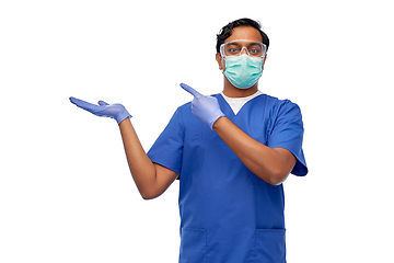 Image showing indian male doctor in mask showing something