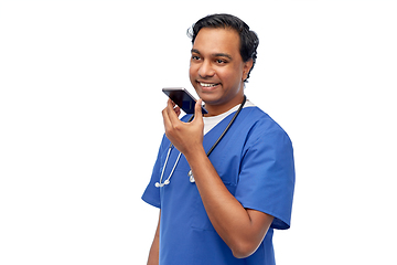 Image showing indian male doctor recording voice with smartphone