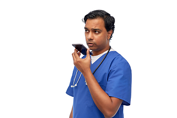 Image showing indian male doctor recording voice with smartphone