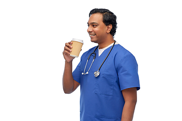 Image showing male doctor with stethoscope drinking coffee