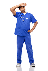 Image showing stressed doctor or male nurse in blue uniform