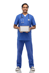 Image showing happy doctor or male nurse showing tablet computer