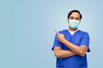 Image showing indian male doctor in blue uniform and mask