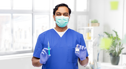 Image showing indian doctor in mask with syringe and medicine