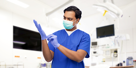 Image showing indian male doctor in uniform, mask and gloves