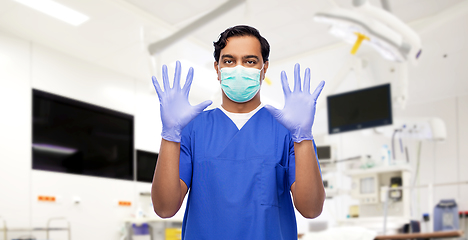 Image showing indian male doctor in uniform, mask and gloves