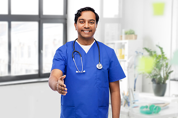 Image showing happy indian male doctor giving hand for handshake