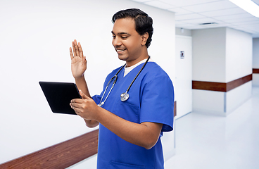 Image showing doctor or male nurse has video call on tablet pc