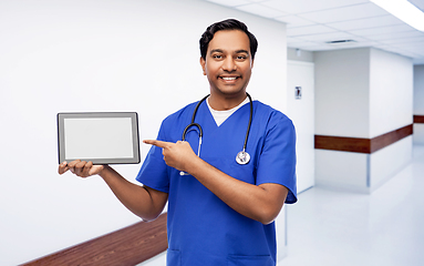 Image showing happy doctor or male nurse showing tablet computer