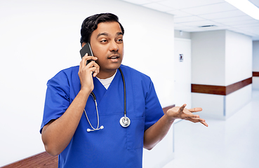 Image showing indian doctor or male nurse calling on smartphone