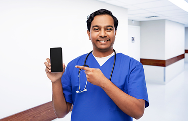 Image showing happy indian doctor or male nurse with smartphone