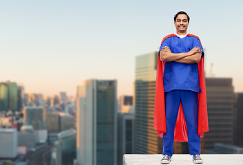 Image showing doctor or male nurse in superhero cape in city