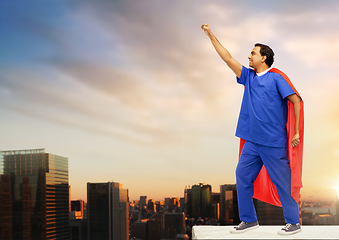 Image showing smiling doctor or male nurse in superhero cape