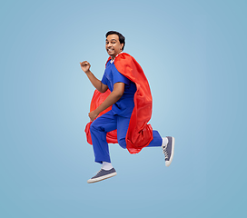 Image showing doctor or male nurse in superhero cape jumping