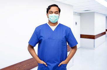 Image showing indian male doctor in blue uniform and mask
