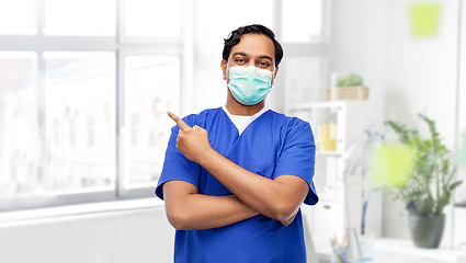 Image showing indian male doctor in blue uniform and mask