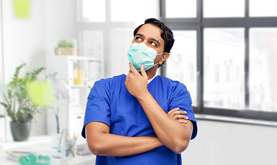 Image showing indian male doctor in blue uniform and mask