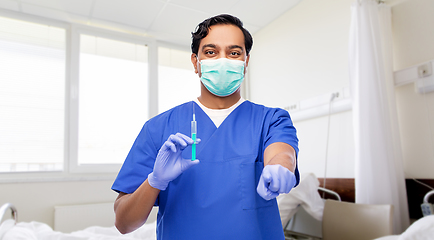 Image showing indian male doctor in mask with vaccine in syringe