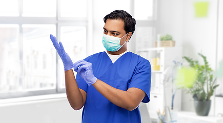 Image showing indian male doctor in uniform, mask and gloves