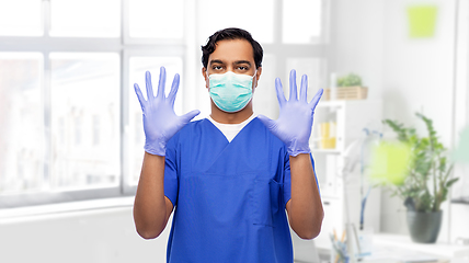 Image showing indian male doctor in uniform, mask and gloves