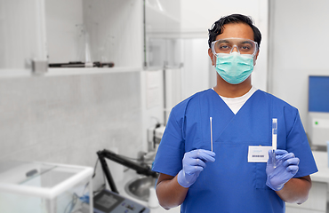 Image showing male doctor in mask with cotton swab and test tube