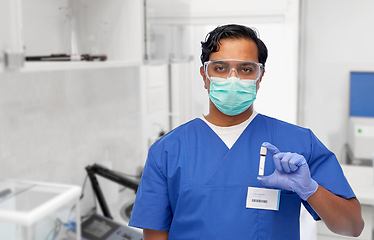 Image showing indian male doctor in mask with blood in test tube