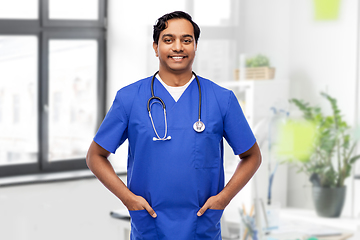 Image showing happy indian doctor or male nurse with stethoscope