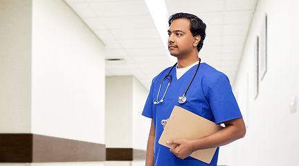 Image showing indian male doctor with clipboard and stethoscope