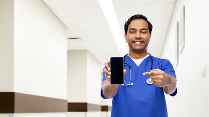 Image showing indian doctor or male nurse with smartphone