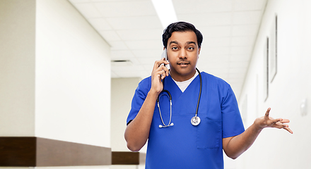 Image showing indian doctor or male nurse calling on smartphone