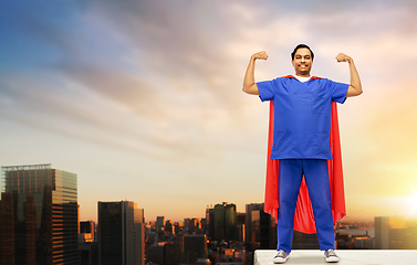 Image showing smiling doctor or male nurse in superhero cape