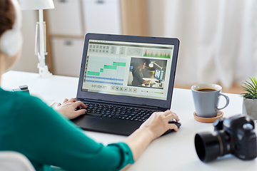 Image showing woman with video editor program on laptop at home