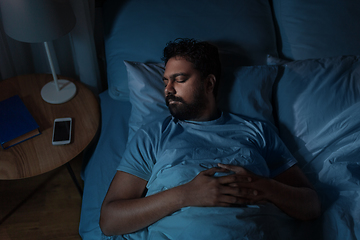 Image showing indian man sleeping in bed at home at night