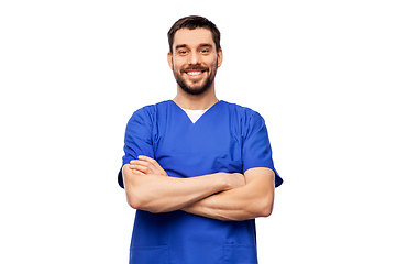 Image showing happy smiling doctor or male nurse in blue uniform