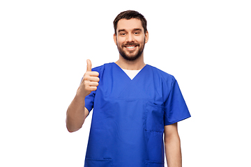 Image showing happy smiling male doctor showing thumbs up