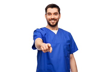 Image showing doctor or male nurse pointing finger to camera