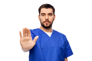 Image showing doctor or male nurse showing stop gesture