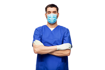 Image showing male doctor in blue uniform, mask and gloves