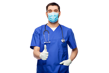 Image showing male doctor in blue uniform, mask and gloves