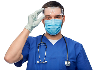 Image showing male doctor in goggles, mask and gloves