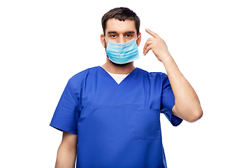 Image showing male doctor in blue uniform in mask