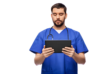 Image showing doctor or male nurse using tablet computer