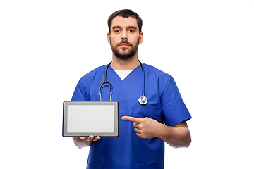 Image showing doctor or male nurse showing tablet computer