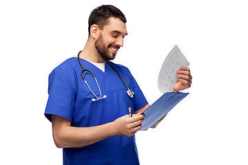 Image showing smiling male doctor with cardogram on clipboard