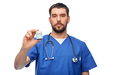 Image showing doctor or male nurse with medicine and stethoscope