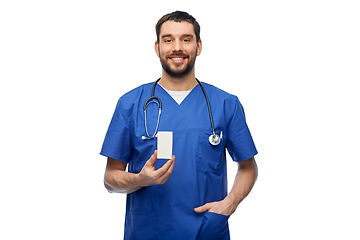 Image showing doctor or male nurse with medicine and stethoscope