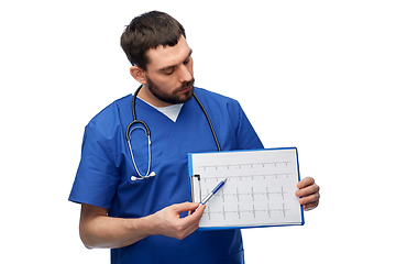 Image showing male doctor with cardiogram on clipboard